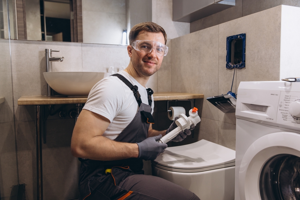 man installing shower head